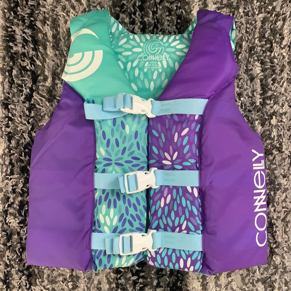 Youth girls life jacket, 50-90 lbs. purple and teal, gently loved.